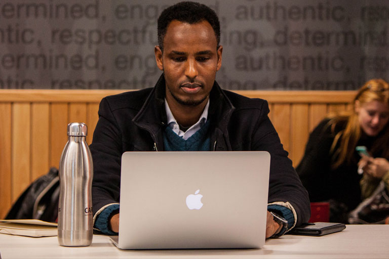 Picture Black man using laptop