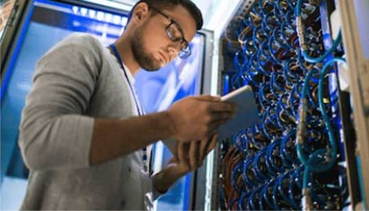 Picture of Young White Male checking/testing Network circuits